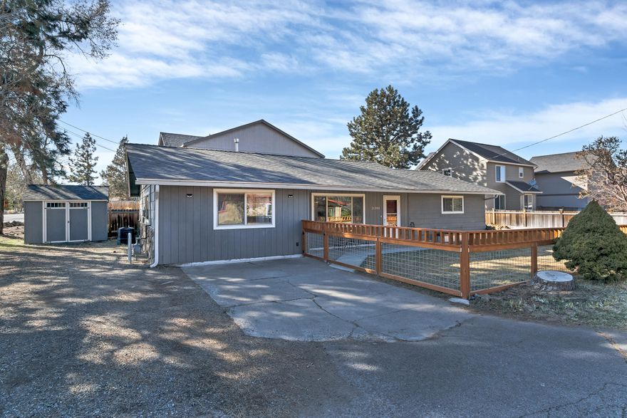 This charming and tastefully updated single level ranch style home is located on a large lot and ready for you to move right in. With fresh paint, new floors and a country feel, you'll love the location of this cozy home as you are just minutes from Costco, the hospital and shopping. The yard is fully fenced with a patio, raised garden beds and two outdoor sheds. The garage has been converted for use as a bedroom, bonus room or home office. Spacious laundry room includes a 1/2 bath, plenty of storage and a solar water heater.