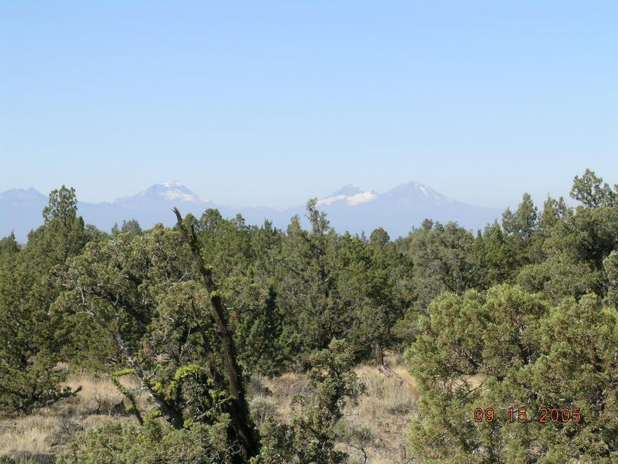 20 acre parcel in gated community with sweeping views of Cascades and Powell Butte.  Lot sits high at back edge of community.