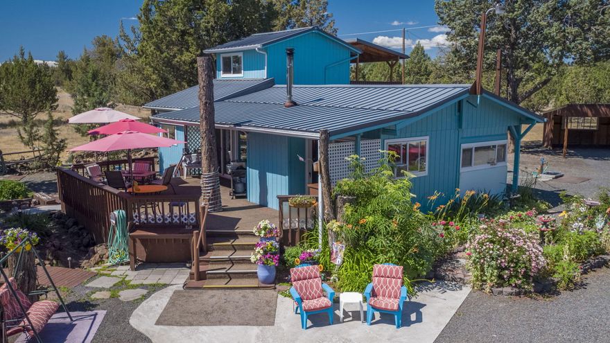 Don't miss this rare opportunity to own two buildable lots in the Forest Park neighborhood—with no HOA dues and just minutes from the Deschutes River boat launch at Lake Billy Chinook. This unique property features a cozy stick-built home attached to a vintage mobile, combining character and comfort in a peaceful setting.The beautifully landscaped yard  with established flowers and vegetation creates a true retreat, perfect for relaxing or entertaining. A private well supplies water for personal use and gardening. Additional highlights include a double-entry driveway and ample space to expand.Whether you're seeking a full-time residence or a vacation getaway, this property offers flexibility, charm, and outdoor lifestyle potential. Schedule your showing today, don't miss out on this cute property!