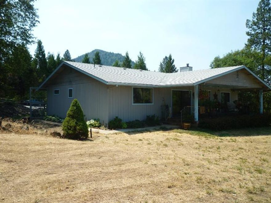 You finally found it! Your new home in the country, yet located close to town. The property offers very nice views of the city and surrounding mountains and there is ample elbow room for gardening. Large attached garage can park 3+ cars and a newly built large shop that is fully finished with heat/air and car hoist! The cozy home has a free standing gas stove and layout takes advantage of the wonderful city/mountain views and also has a large covered deck on the view side. Generator in place and wired in case of power outage, covered breezeway newly tiled. Plenty of storage and possibilities make this property a must see! This is not a drive by, please respect owners and neighbors privacy. Make appointment to view property.