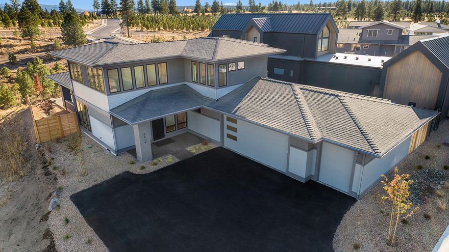 Contemporary Discovery West home built by award winning collaboration of Ollin Construction & Jason Todd Designs. Covered front porch leads to entry/great room engulfed in natural light. Kitchen features exquisite appliance package, slab quartz counters and custom built-in cabinetry with soft-close doors and drawers. Main level resident suite with tile walk-in shower, radiant heated bathroom floors and walk-in closet. Upstairs includes two guest bedrooms, full bathroom and loft area. Oversized garage with additional ''gear garage'' bay for all your requisite Central Oregon toys. Discovery West, situated on 245 acres on Bend's westside, is the newest community by the developers behind the award-winning NorthWest
Crossing neighborhood. The neighborhood will offer a variety of home types and sizes, as well as a community plaza and 40 acres of parks, trails and open land.