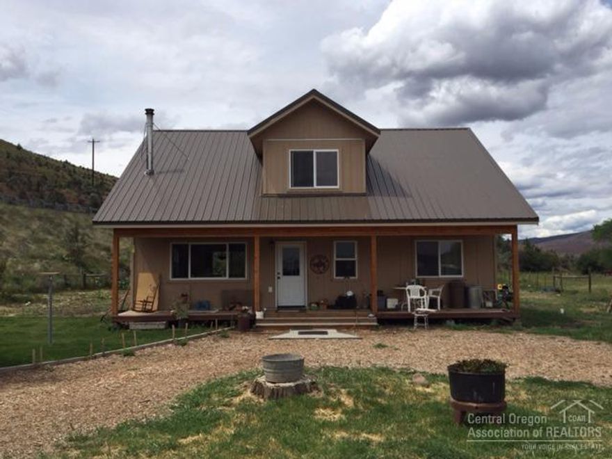 Newer 2 Story Home On The John Day River! 18 Acres, 10+- irrigated, 1840 sq ft 3 bedroom, 2 bath home, carpet & vinyl flooring, wood & electric heat, metal roof, deck, landscaped, garden area, barn, shop w/concrete floor & 220, open bay w/carport, storage shed w/loft, fenced, gravel drive, abundant wildlife. $239,500 #817