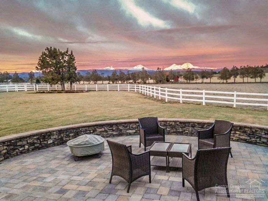 A gorgeous Horse and Cascade Mountain View Property on 32 Acres with 20 Acres of Irrigation. Quality Hay, 10,000 Sq. Ft. Indoor Arena & Barn, interior/exterior stalls, wash rack area & heated tack room. Fenced with a loafing shed, plus Outdoor Arena, Pond, Waterfall & lots of parking. Home was beautifully remodeled in 2014. Upgrades include Stainless Steel Appliances, Slab Granite Counters, Cherry Cabinets, Maple Hardwood Floors, Gas Fireplace, Office with own entrance & Private Iron Electronic Entry gate.