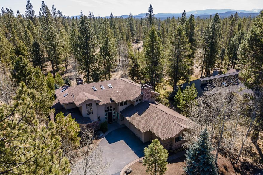 Private elegance awaits you! Nestled among the trees, this custom-designed Tim Nolte home sits in the heart of Sunriver on a quiet culdesac backs to National Forest for ultimate privacy. Soaring ceilings allow an abundance of natural light to spill into the greatroom with its floor-to-ceiling wood burning fireplace. Double sliding doors open onto the paver patio, setting the stage for entertaining with a water feature and established landscaping adding to the ambiance. Maple hardwood floors run throughout - the main floor features the primary bedroom with expansive walk-in closet and tiled en suite bath, kitchen with granite slab counters and pantry, formal dining, and utility room. Don't miss the elevator leading up to the office! The second story has a guest suite, 3rd bedroom, office with fireplace, exercize room and full guest bathroom. Never rented, 1st time on the market, this home has been meticulously cared for and is ready for a new owner!