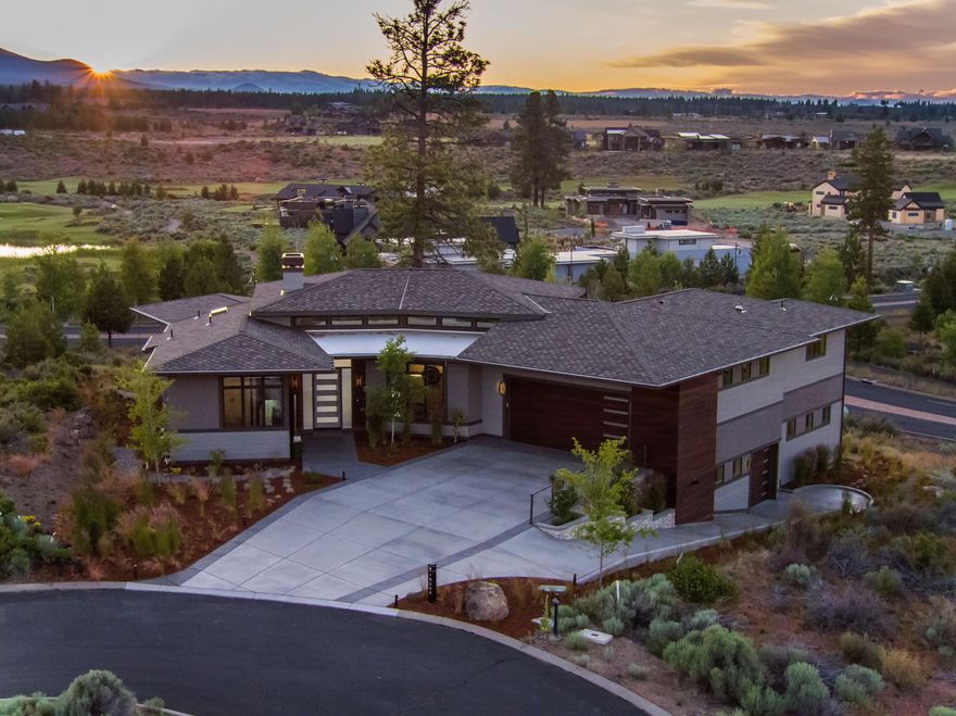 Lovely contemporary home, sitting on .66 ac lot with panoramic views of the Cascades and every attention to detail.  3+ bedrooms, 4 1/2 baths, 17' ceilings in great room with folding 12' LA CANTINA DOORS, plus   gas fireplace with mid-century style black floating hearth.   Chefs kitchen with gray honed granite island and counters, KONA cabinetry, SS BOSCH appliances, pantry and breakfast bar.  LED lighting throughout.  Custom built-in bar in Dining room with SS sink  , HOSHIZAKI TOP HAT ice maker, plus wine cooler.    Each BR has own bath, large closets.  Master and West BR have heated floors.  Entire house wired for SONOS Sound system.  Downstairs Rec/Media room features 5/8'' soundboard for soundproofing.  Full Bath downstairs plus new 761sf bonus area.  Circular fire pit accessible outside of Rec Room.   Area for golf cart/storage.. Garage has 3 coat epoxy floor, wired for electric car. Automated snow melt system under driveway and all walkways.  Qualified buyers only.