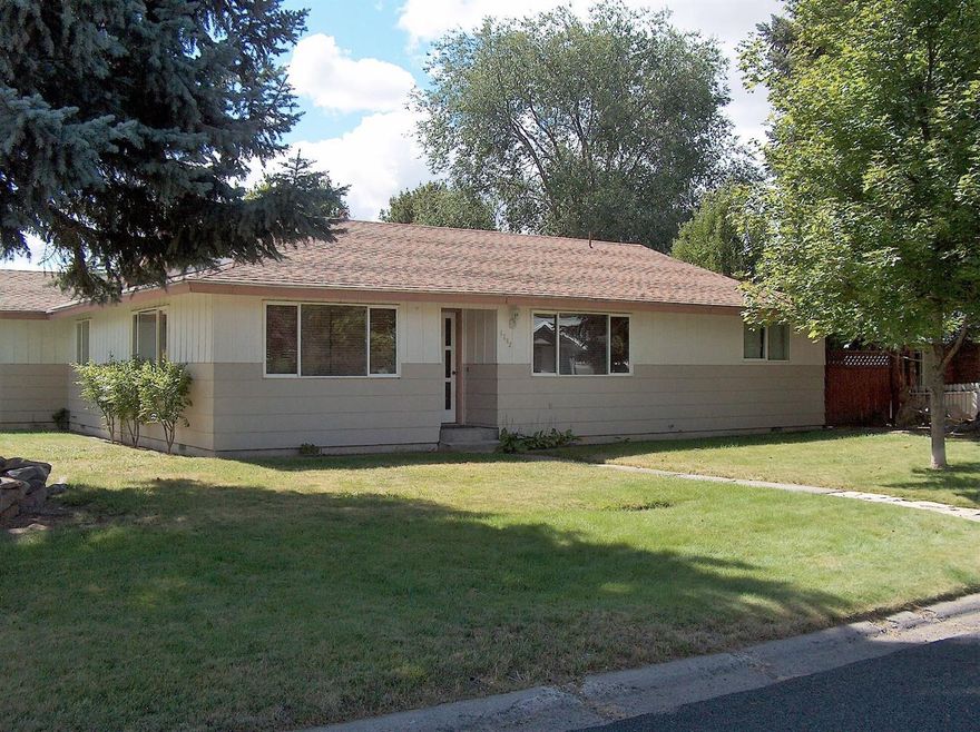 Single Level Gem! This nice corner lot offers a 3-bedroom 2 bath home and a 2-car garage that will give you 1552 sq. ft. of generous space to move about without losing that quaint feeling. Newer carpet and padding and just freshened up paint with Hickory doors most of the transformation has been done. Easy landscaping with inground sprinkles in front and a fenced back yard. Plum, apple, and cherry trees. Seller is leaving a shop heater, Louvered doors, tree rings, Vanity Mirror w/ medicine Cabinet, Flat Screen wall mounts, & window A/C Unit. Don't wait make your appointment to see today!