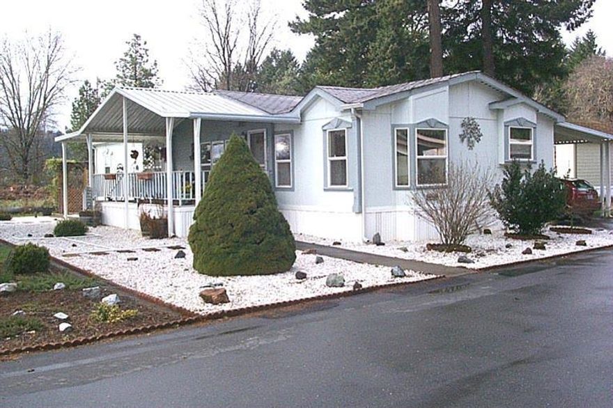 Must have BCD lic. to list or seller Manufactured homes only. This stunning home has had much TLC over the years. The home is a 2 bedroom (both very spacious) / 2 bath home (Guest bathroom has toilet, sink and walk in shower. Master bath has double sinks, a newer Walk-in tub, toilet, linen closet and other cupboards) Over 1600 sq. ft. of living area. Walk into the open Cathedral Ceiling living room with a bank of windows to the east side of this home. Then walk through the arched doorway into the dining room and kitchen. Almost all appliances are less than 2 years old and go with this home sale. The kitchen features a ton of cabinets lots of counter space, a breakfast bar & a built in desk. The front of the home featured a large covered front deck that looks out onto the landscaped yard. Much of this yard is easy maintance plus there is a fenced garden area. Arbor towards the back leads to your potting shed. Everything is already done for you to move right in!