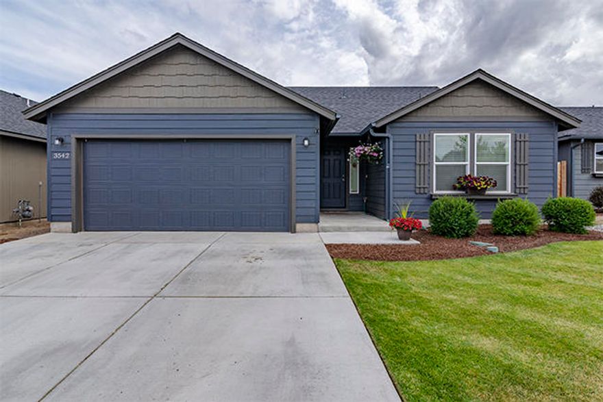 Immaculate like new home in desirable southwest Redmond location, within walking distance of Hayden Park.  This home is a one level with 1408 sqft, and features 3 bedrooms and 2 bathrooms, a laundry room, and A/C.  It has a fully fenced backyard and an oversized garage that will fit a full size truck with 220V outlet!  Inside has vaulted ceilings in the open concept great room, a vaulted master bedroom with his & hers closets.  Schedule a preview of this lovely home today!