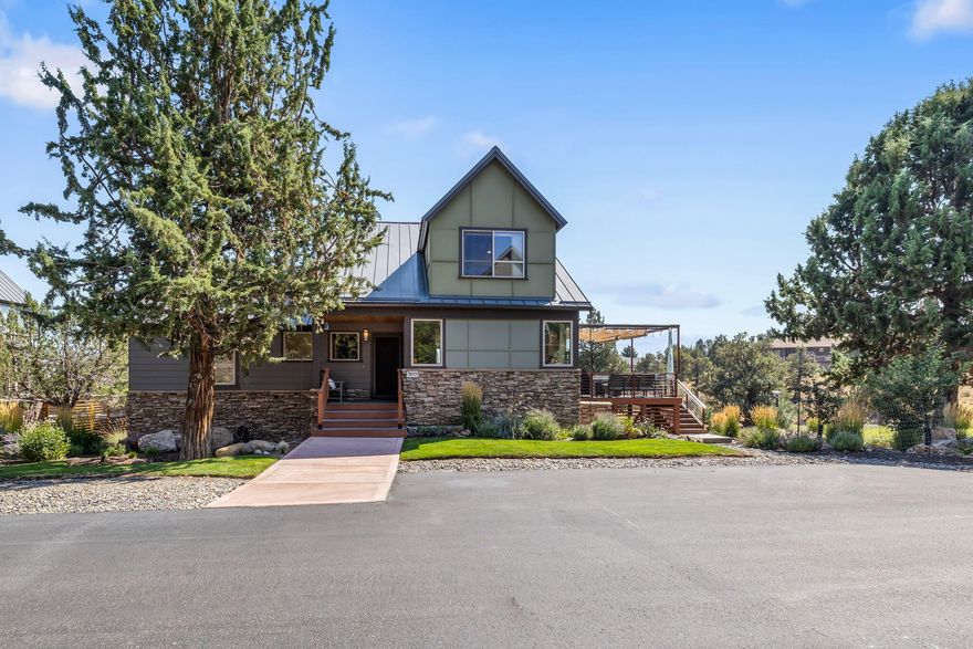 Sophisticated design meets high desert beauty in sought-after Highland Parks at Eagle Crest Resort! Located on one of the larger lots at the end of the street across from the common space and the walking path to the sports center. Mountain foothill architectural design with passive solar orientation, extensive stonework base, expansive Trex deck, metal roof, 800 sq ft extended two-car garage with an additional 500 sq ft storage room. This thoughtfully updated home offers dramatic easterly views of Smith Rock, the city lights, and the Ochoco Mountains. The unique one-of-a-kind floor plan features the primary suite on the main level and boasts lofty ceilings, banks of windows, a built-in media center, a stacked stone fireplace, and a sunken living area. Chef's kitchen with slab granite countertops, pantry, breakfast bar, gas range, and stainless appliances. Stunning primary bath with heated floors, a walk-in shower, and slab granite counters with double sink vanity. Guest parking pad.