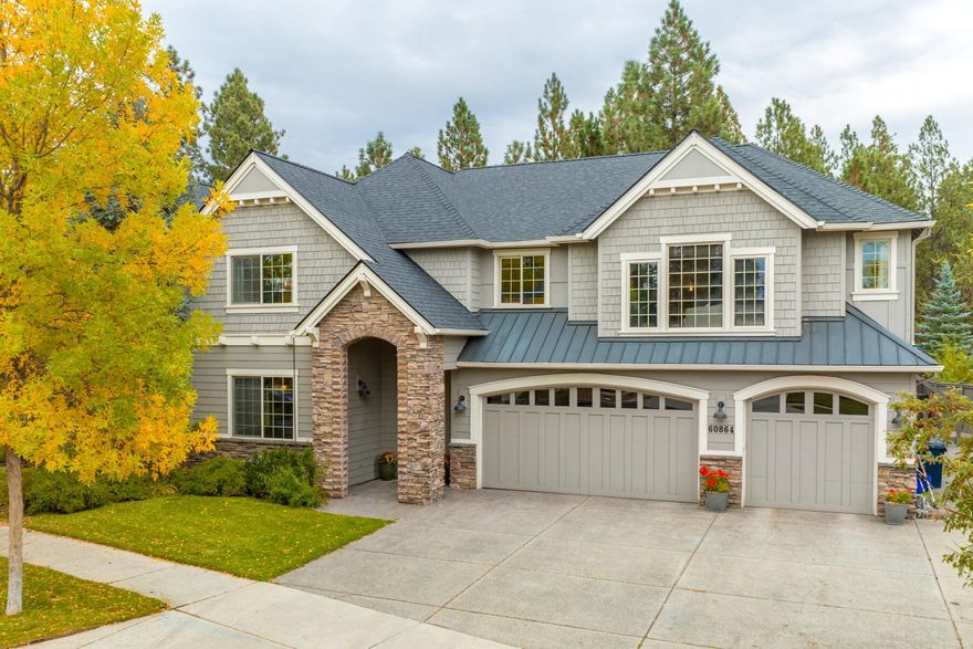 You're sure to love this exceptional home in SW Bend! With 5 bedrooms, a dedicated office and a spacious bonus room, this floor plan is hard to find and even harder to beat. A dramatic two story wall of windows provides exceptional light to the open concept main living area of this home, while a gas fireplace warms the room. Life moves seamlessly from the spacious kitchen with plentiful cabinets & counters, large island with gas cooktop & bar seating, to the covered back patio & fully fenced yard. A separate office & guest suite complete the main level. Upstairs, a cozy loft & expansive bonus room provide additional flexibility to the floorplan. The primary suite features a window seat, soaking tub, dual walk-in closets & adjacent workout/work space. 3 more bedrooms & a full bath are on the upper level. Don't forget, there's also a 3 car garage AND the detached, heated shop with a guest suite is ready for your project or possible conversion to an ADU. Don't wait on this one!