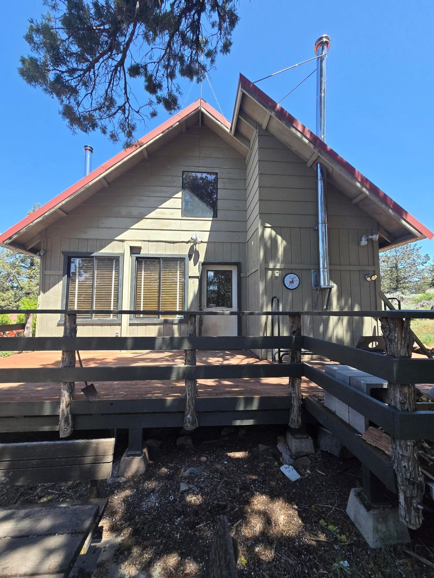 Looking to live away from the city for an off grid feel but with a well, septic and electricity?  Look no further.  Nestled atop a mountain outside Dorris on almost 40 acres with breathtaking gorgeous panoramic views, this rustic home has a loft that could be used as a bedroom, A/C, ceiling fan and a metal roof. Huge garage/shop is plumbed for a bathroom and a self sustaining generator. Extra sheds for storage, a log splitter, a 300+ gallon portable fire suppression system and all appliances are included. This peaceful property has lots of trees including a few pear and apple trees, fenced off area for gardening and a lookout point. Envision yourself waking up to complete privacy, tranquility and beautiful sunrises...relaxing with spectacular sunsets and then star gazing at night from your very own private retreat.  If you're looking for a peaceful, mountain oasis, your dream home awaits. Schedule a private viewing today and experience life at the top! CA DRE 02145244/FNRCA DRE 02074