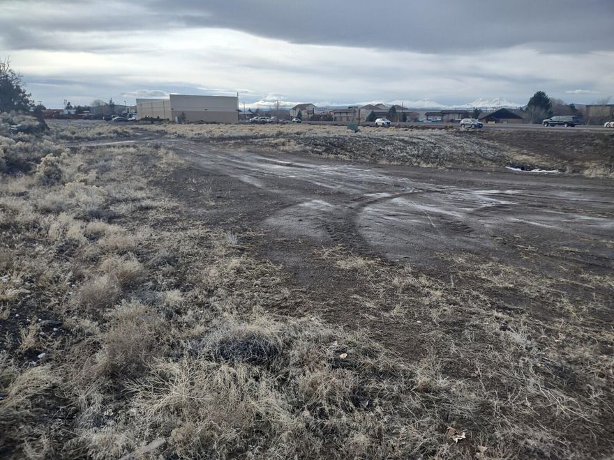 One of the few available large area commercial sites in Redmond. Hwy 97 access. High visibility Highway location with very heavy traffic flow. 4 separate level tax lots, Multitude of uses on this C1/C2 property. Directly across Hwy from Gateway to City and ''Flag City USA'' monument.