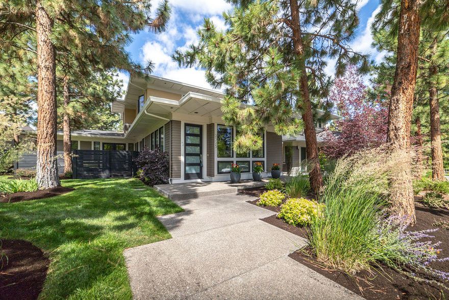 This prairie style, immaculate Northwest Crossing home is in an ideal location on a quiet street near Compass Park and a few blocks from the charming central business district and Saturday farmer's market. With an amazing open floor plan, master on the main, and an upstairs bonus room/den area, you will find the perfect cross-section between timeless design and function. The kitchen boasts a very high end Italian Bertazzoni gas stove and large kitchen island for entertaining. The fenced in courtyard through the french doors off of the kitchen is an ideal spot for private outdoor space and al fresco dining.
On top of all of this, there is a 20' x 15' concrete parking pad off the alley separate from the garage & driveway which allows for additional off-street parking. Northwest Crossing is an award-winning community in the heart of the west side of Bend and close to trails, schools, and parks.