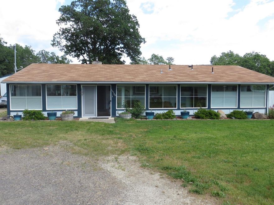 Pride of ownership every where you look. Nice open floor plan. Very nice master bedroom and bath and good sized off bedroom. Sun porch off kitchen area to enjoy the morning and deck off master bedroom. Circular drive for easy in and out. Huge shop 20' x 40' with 10' x 12' roll up door with electric and remote opener. Plenty of room and benches for all your projects. 22' x 45' 2 stall barn, possible 3rd stall and storage area with electric and concrete floor thru-out. Property is fenced and cross fenced with multiple gated pasture areas. A great place to live and enjoy the country.