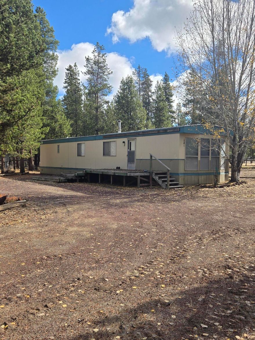 Cuter than cute!! Ready to go with Brand new well!!  Two tax lots are being sold together, tax lot 8400 includes a very well maintained 1965 singlewide completely furnished home just waiting for its new owner.  Home sits on Tax lot 8400, Tax Lot 8300 is a 1 acre undeveloped lot! The possibilities for these two properties are endless!