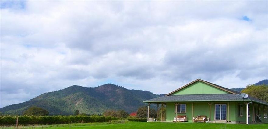 37+ acres in the heart of the Applegate Valley next to Troon Winery, with nice 1,984 s/f rancher resting amongst picturesque vineyards and overlooking a four‐acre bass stocked lake on the adjoining vineyard estate which is also available, (see MLS#52940639) with extensive landscaping in addition to the elegant residence. Vineyards: 18 +/- Acres Planted, with 14 +/- additional plantable acres. Water: Two wells: 1) Approximately 20 gpm for domestic and irrigation for the neighboring parcel under Permit G 16184, 2) Approximately 50 gpm for domestic and irrigation for the subject parcel under Permit G 16184.