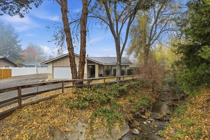 Currently operating as a successful Airbnb, this beautifully maintained property offers an exceptional investment opportunity (with furnishings available for purchase) or the ideal place to call home. The beautifully updated kitchen showcases sleek quartz countertops, newer stainless-steel appliances, a spacious breakfast bar, and modern cabinetry, creating the perfect space for cooking and entertaining. Ideally situated directly across from the Rogue Valley Medical Center and within the sought-after Hoover, Hedrick, and SMHS school district, the location provides unbeatable convenience and strong long-term value. A picturesque stream runs alongside the home, adding a serene, natural ambiance that enhances the property's unique charm. Additional highlights include a cozy wood-burning fireplace, ample parking, and a welcoming covered front entry. With its inviting atmosphere, thoughtful upgrades, and prime location, this home stands out in today's market!