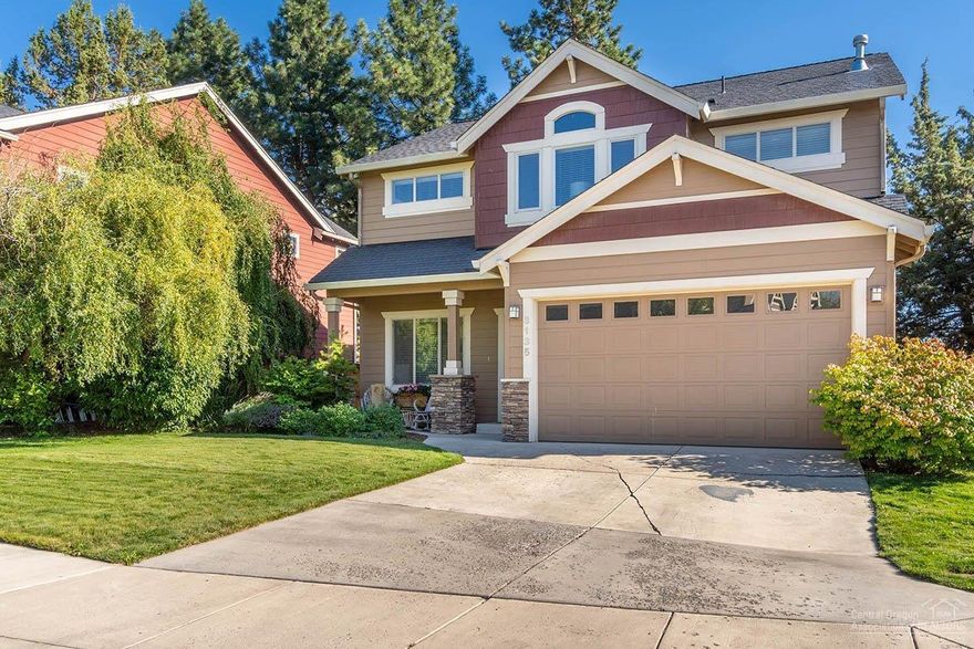 Beautifully taken care of light & bright home. 4 bedroom, 3 full bath. Kitchen/dining area opens to great room with gas fireplace, 1 bedroom with full bath downstairs. Kitchen with hickory cabinets, island, tiled counters, wood floors, Amana stainless appliances, pantry. Wood flooring on lower level. Upstairs 3 bedrooms, loft, utility room, 2 full baths. Backyard partially fenced. Mature trees. Quiet street.