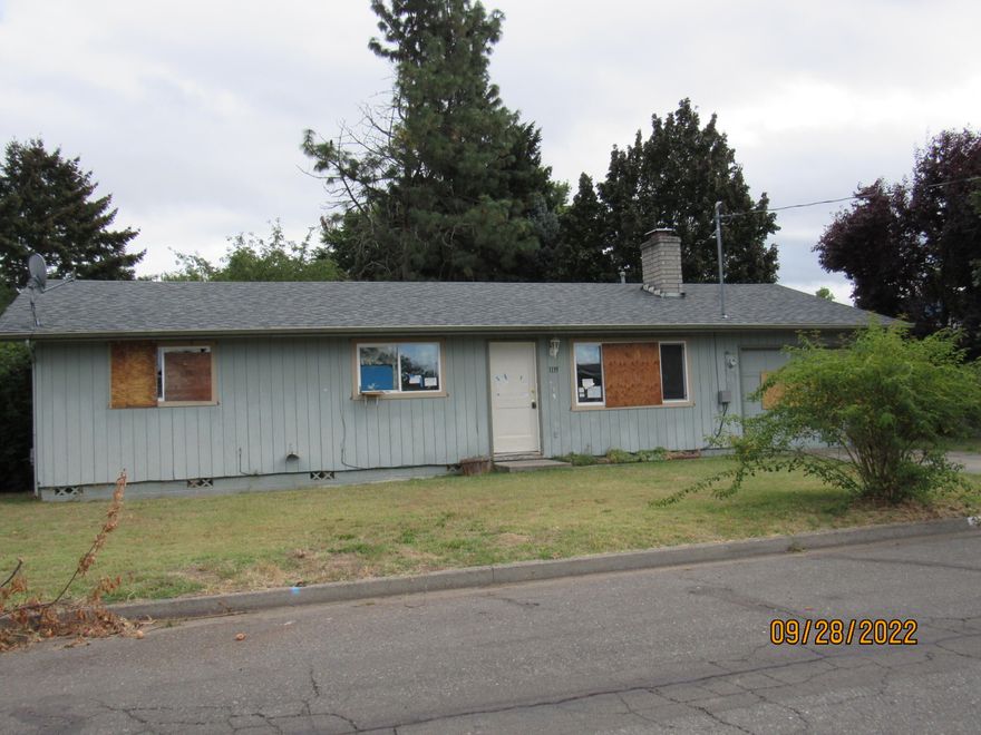 This home is in need of repairs and clean up, nice floor plan and large back yard with storage building and fruit trees.