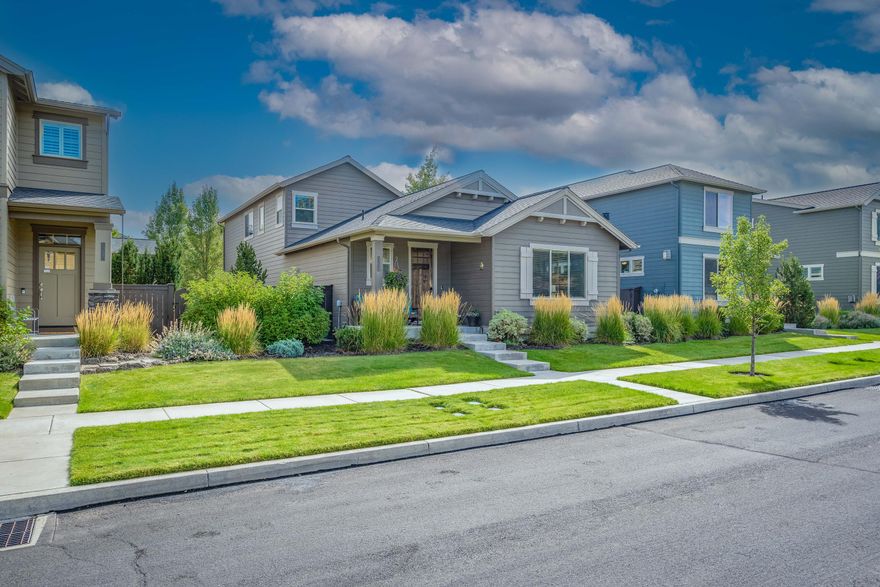 $20,000 CREDIT FOR CLOSING COSTS/RATE BUY DOWN! This quality built Pahlisch home boasts the primary bedroom on the main level. Enjoy the open concept main level with cozy gas fireplace, built in desk and vaulted ceiling plus the loft upstairs (currently being used as 2 home offices)! Quality finishes include: stained shaker style cabinets, Quartz counters throughout, tile shower, stainless steel appliances, luxury laminate plank flooring & window encasements throughout main  floor, bathrooms & laundry, crown molding in the trey ceiling downstairs, baths & laundry, gutters, attached oversized 2 car garage, fencing, AC, hot tub & much more. Located in one of NE Bend's most sought-after neighborhoods, residents enjoy a community pool, front yard maintenance & close proximity to Pine Nursery Park (pickleball courts, playground & trails), Lava Ridge Elementary, medical facilities and Cascade Village shopping. This home is ideal for those seeking both adventure and comfort in Central Oregon