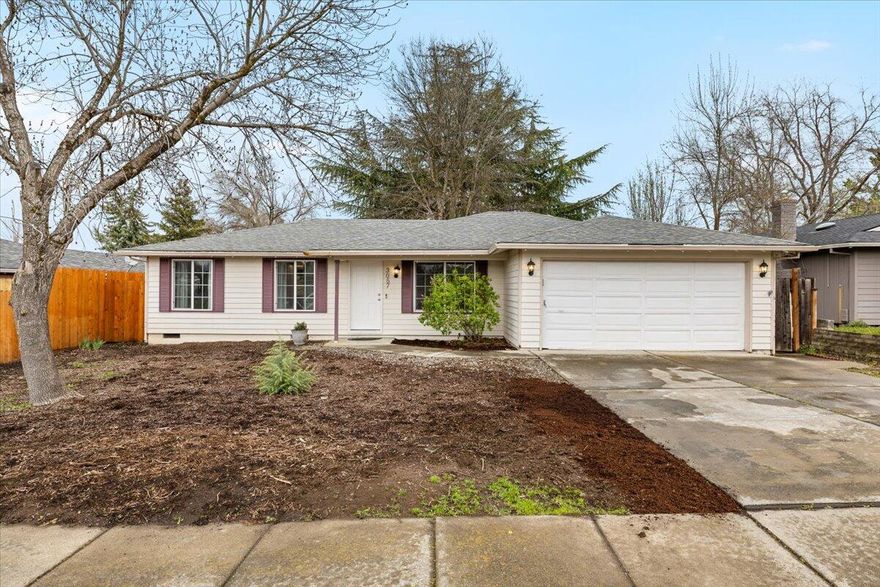 Beautiful 3 bedroom/2 Bathroom home in desirable East Medford. This home offers a large living room with gorgeous vinyl plank flooring, coffered ceiling, and recessed lighting. The kitchen is lovely with tons of custom-painted cabinets for storage, solid stone countertops, bright custom lighting, stainless-steel appliances and a huge pantry area. Large Laundry room offers more cabinets and folding counter space. The Mater Suite is sizable with his/hers closets, and standing shower stall with built in seating. Outside you'll enjoy a large fully fenced backyard with a deck perfect for grilling with company or enjoying the coming beautiful weather, and mature landscaping with trees and bushes for added privacy. This is a perfect first time home, or a great investment, don't miss it!