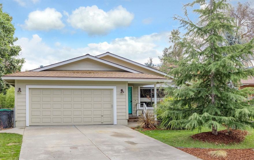 Get inside this cozy single level home. Walkable to restaurants, schools, parks and the library, this is an ideal option for a family or retirees. Kitchen and large master have direct access to the beautiful backyard, perfect for kids or a garden. The kitchen also opens to the living room, complete with fireplace and lofted ceiling. Part of the garage has been converted into a studio, great for an office, storage, or could easily be reconverted. Fantastic location, convenient to Medford, Ashland, Jacksonville and the rest of beautiful Southern Oregon. Washer, dryer and other appliances included. Video walkthrough available upon request.