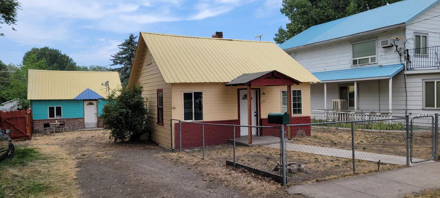 This is a small home, It will be a project to get it shining again. This would make a great AirBnB or Rental. It has a 300+ Sq. Ft. shop/office that is also on the lot. The could be a great headquarters for a small business. Great lot with ally access,