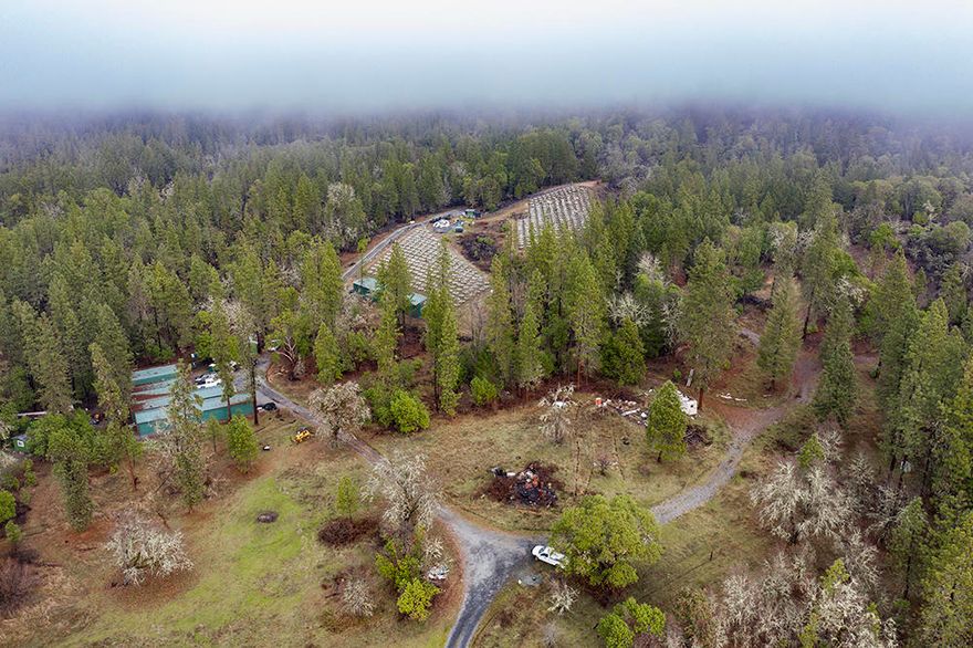 82.69 Acres of beautiful, extremely private acreage that is zoned EFU! The property comes with many well-maintained outbuildings, three seasonal creeks, a 40GPM well (per well driller's log), 700 amps of power, and nursery water rights! Also included are three 2500 gallon water storage tanks, 2-3 Acres of cleared garden area with a fully functional irrigation system.  Beautiful cleared area to build your dream home with a view of the mountains. Buyer to perform their own due diligence in regards to the use of this property. Contact us for more information today!