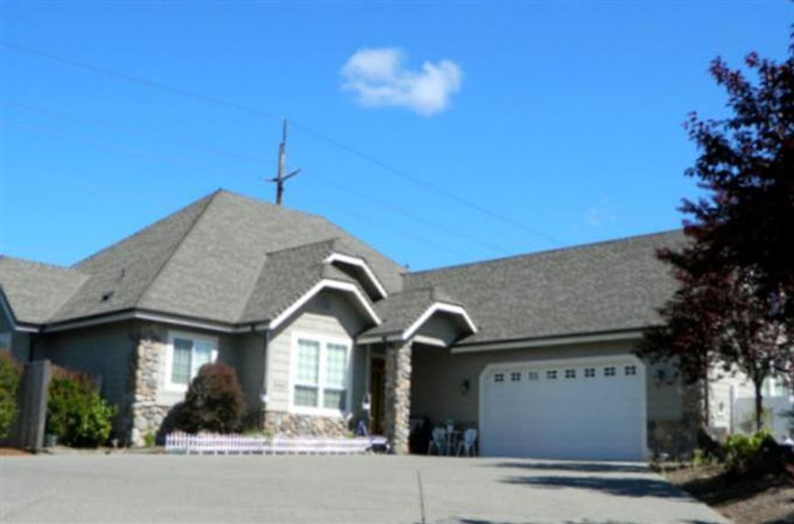 Gracious Custom Home in Exclusive Neighborhood. 10' ceilings, gas fireplace and hardwood floors are just a few of the upgrades in this home. 2293sqft home on .24 acre lot. Open floor plan, kitchen boast of granite counters, breakfast bar, abundant cherry cabinets, pantry. Formal dining or den off living room. Spacious master with private bath and walkin closet, double sink, shower and jetted tub. Extra large additional bedrooms. Loads of closet space, laundry room w/laundry sink & cherry cabinets, oversized triple garage with work shop with pull down storage. Storage covered patio. Access to Grants Pass Golf Course.