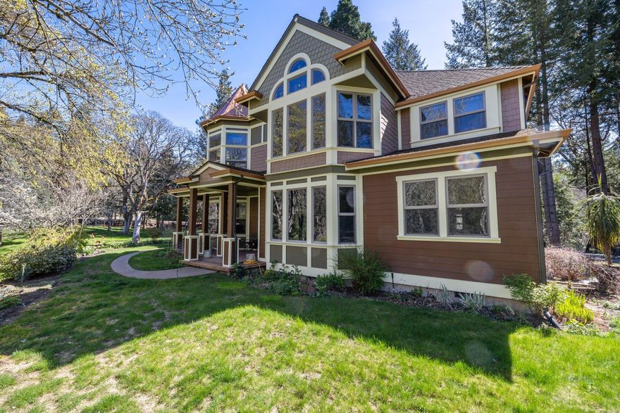 This private 114-acre estate features a 4,400+sq ft Victorian-style dream home surrounded by mature trees overlooking beautiful pastures, lush mountains, and a year-round creek with irrigation rights. Inside the open and spacious home many large windows supply gorgeous views. On the lower level you will find the exquisite finishing of the maple hardwood flooring and cabinets, a great stone fireplace in the main living room, office or 5th bedroom and an expansive gourmet kitchen complete with granite counters, a central island, a Wolf 6-burner gas range a built-in refrigerator and a connecting morning room with stunning views of the creek. The second level features a large central open loft, and 4 spacious bedrooms, 2 of which have their own en-suite bathrooms and walk-in closets. On the 3rd level you will find a large open space with skylights. Zoned EFU includes water rights 40 acres irrigated land ½ mile of year-round creek frontage. 1600 sq ft 2-story shop and so much more