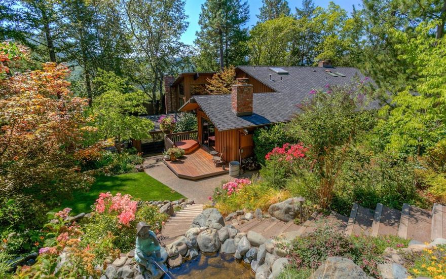 169 acres in a forested private valley surround this magnificent estate home that abuts vast BLM holding for superior peace and privacy. Landscaping that rivals any great park encompass the stately home with abundant variety of trees, bushes, colorful perennials, flowering plants and lawns for outside enjoyment. It's breathtakingly beautiful year round. The residence is a grand lodge style home with uncommonly beautiful beams and wood work throughout the home and it has been impeccably maintained and updated. It is both formal for entertaining and warm and inviting for family and friends. There are 3 bedroom suites. The master suite is stunning and private with its own fireplace and private decking and porch to a private back garden area. The formal living room has 24' ceiling with towering rock fireplace and 16' tall Pella widows that allows the parklike setting of the trees to be a part of the room. Formal dining room is elegant with sky artwork coffered ceilings and it leads into a