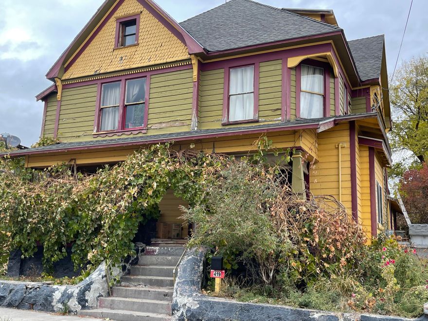 GREAT INVESTMENT OPPORTUNITY to the right person willing to polish up this Gem. Was Originally  boarding house.. Home currently brings in $2200 per month rent. Home has three stories plus a basement. The main floor has a Bedrooms and 1 bath , 2nd floor has 4 bedrooms 1 bath and 3rd floor has 2 bedroom 1 bath  and office .  Basement has 1 Bedroom and a shop as well as another bathroom which has not been used . 2nd house has 5 bedrooms ,kitchen, living room sitting area and 1.5 baths . 3rd and 4th house are not being used and would need work but are 1bed 1 bath and the other is studio all plumbed for bathrooms. This is a beautiful property with wonderful fruit trees such as Plumbs, peaches and apples.