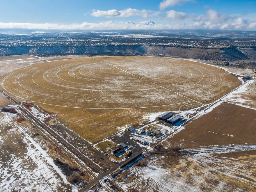Culver Farm is 376 acres with Cascade Mountain Views over looking the Crooked River Canyon. Farm is planted in grass seed and alfalfa, 286.1 acres of Deschutes water right irrigated by 10 tower pivot approx 275 acres with blue grass seed contract, wheel lines and hand lines for alfalfa field. Improvements include: 2628 sq ft 3 bedrooms, 2 bathrooms country home, farm accessory dwelling (3 Bd, 2 Ba), shop, equipment storage and 3 hay barns. Property is at the end of the road with a private setting in good farming community, approximately 15 minutes from Redmond.