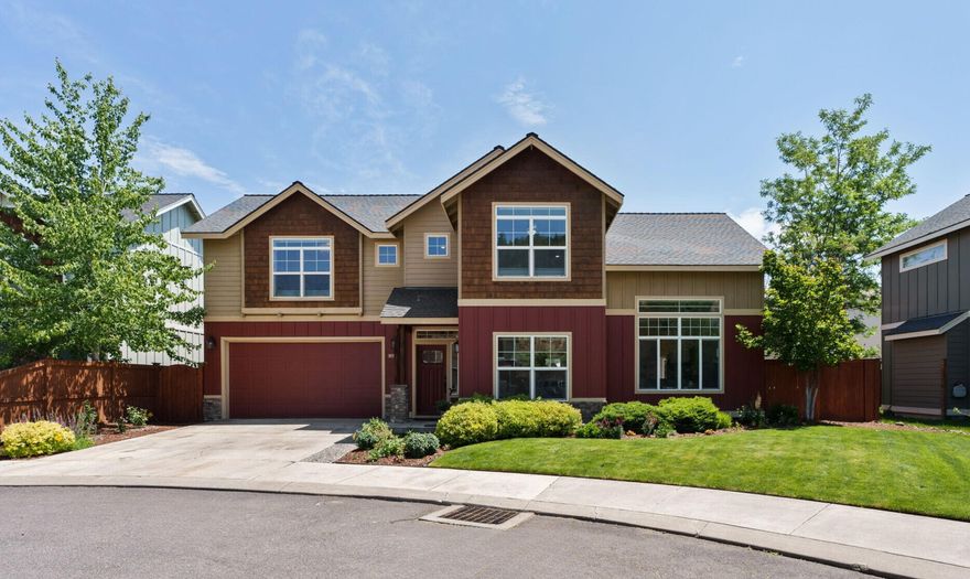 Imagine having one of Bend's most iconic landmarks right outside your door. Tucked in a quiet cul-de-sac directly across from Pilot Butte, this home offers unbeatable access to hiking trails, a playground, and a park. Inside, vaulted ceilings create an airy feel and the open floor plan provides great flow for everyday living. Gorgeous laminate floors ground the space, while large windows flood the home with natural light and frame views of the Butte. Thoughtful improvements throughout— like a new A/C unit, fresh interior paint, updated light fixtures, and a cozy gas fireplace—enhance both comfort and style. The spacious primary suite offers more Butte views and a custom walk-in closet by California Closets. Step into the backyard to find your private Jacuzzi hot tub. On the 4th of July, enjoy front-row views of Bend's best fireworks show—launched from the Butte. This home puts you in the heart of it all— minutes from Bend's beloved breweries and St. Charles Medical Center.