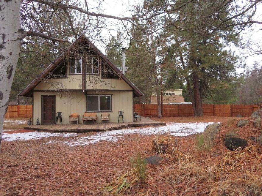 Cute 2 Bedroom, 1 ½  Bath Chalet with detached 2 car garage on ½ acre in Keno.   This home is situated on a large, corner lot in the pines.  It is 1362 SF and has a nice floor plan with the living area and ½ bath downstairs and 2 bedrooms with wood plank ceilings, separated by the full bath upstairs.   The garage has a loft that can be used as a hobby room or storage.  Plenty of room for extra vehicles, the RV and toys.   A tall wooden fence for privacy and pets surrounds part of the property.  New septic in 2018.   Keno Water district.