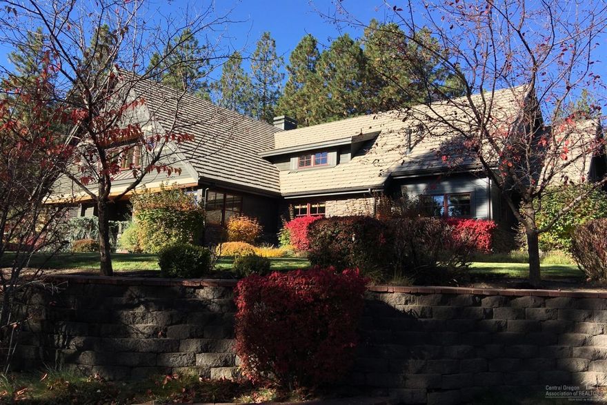 Very unique opportunity to own small acreage close-in on Bend's desirable West Side. Set on almost 3 acres, this 5,351 sf home and property has it all! Interior features include 5 bedrooms with the master on the main level, 4 bathrooms, office, luxury kitchen with walk in pantry, bonus areas, home theater, home-gym, 2 car attached garage and more. Finished with tongue and groove ceilings, solid surfaces in the kitchen, high end appliances, hardwood flooring, and tile, this lovingly maintained home is move in ready. Got toys? This property is dialed. The 4-bay detached garage has room for a full size RV, two additional bays that have extra tall doors, a 4th car bay, and 800 sf of unfinished storage space above. With multiple outdoor entertaining areas, privacy, and underground fencing, all within close proximity to everything Bend has to offer, this property is truly a gem.