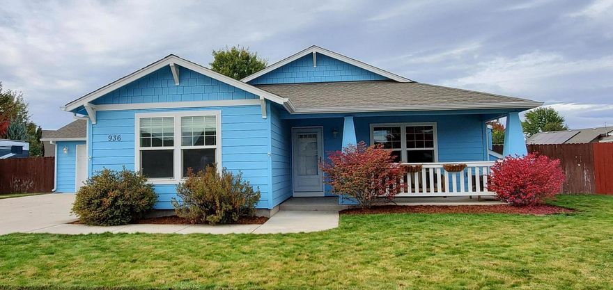 Adorable home with tons of charm! Warm, open floor plan with vaulted ceilings, cozy fireplace and bedrooms opening off living room. 2nd guest bedroom could work great as home office with French doors opening into it. Stainless steel appliances accent the kitchen that has an extra area off to side for breakfast nook or more office area. Laminate flooring throughout and well cared for overall. Lovely landscape in front and back with sprinkler system in both. Back patio is perfect for gatherings and new garden area is perfect for home garden enthusiasts.