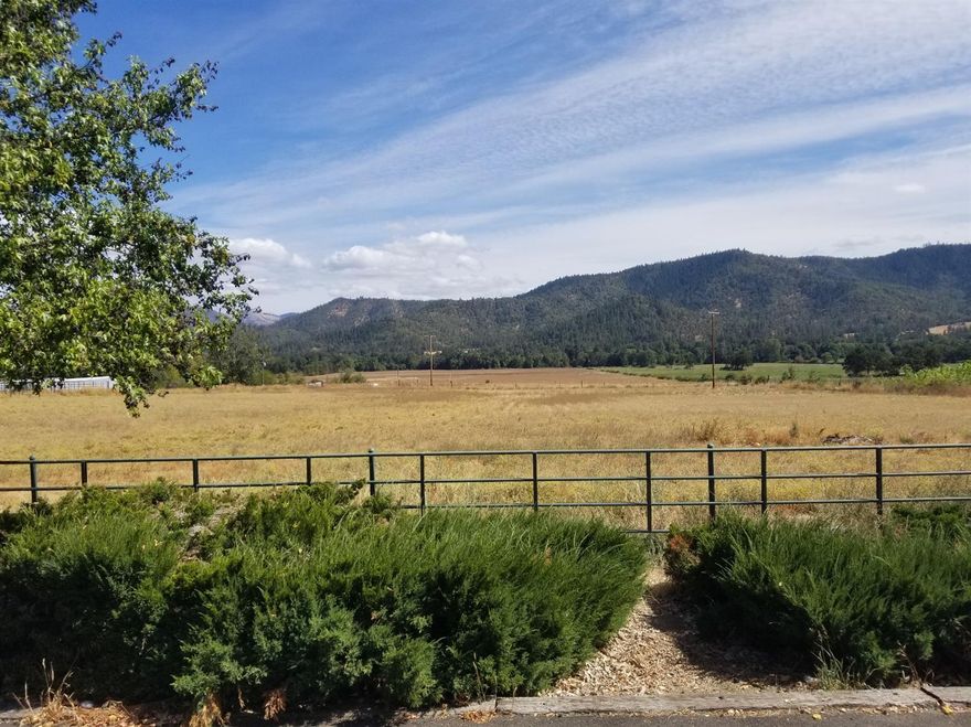 100 acres EFU with 86.30 acres water rights with two tax lots in the heart of Williams, irrigation rights dated 1858, 1891 and 1960 from Williams Creek. Second Seasonal creek runs west to east through the property. Large year round pond centrally located at bottom of top tax lot. Two 30 X 95 Greenhouses installed in 2017 on new pad and access road, installed adjacent to large pond and electric pole. new road and pad installed on second tax lot ready for additional greenhouses or any number of other uses. 1810 sqft single story home built in 1930 remodeled and new roof in 2009. Large paved driveway runs between home and 8 stall horse barn and additional pole barn. Two separate access gates lead in from road. Perfect for many agricultural uses, land perfect for vineyard. Beautiful views and privacy. fenced and cross fenced, wheel line attachments run the length of the pastures. Bring your horses and vineyard plans to your beautiful new farm. buyer to perform own due diligence.