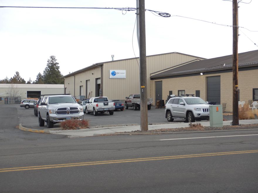 Amazing opportunity for an owner user, or investor to buy a 16,300 square foot industrial building with a fenced yard. 7.5% cap once rents can be increased to market rates. SDC fees paid for manufacturing on 4 of the 5 units. All tenants have 1 year left on their lease, so a new owner can re:negotiate current leases up to market rate, and/or owner/user can move in at that time. 1 dock high door, 8 total roll up doors. 5 total suites, with about 800 sq/ft in office in units 130-140, plus a break room. 3phase, 208V electric. 15+ parking spots. Air conditioner present in the original block building. 18-28' high ceilings - buyer to due diligence to confirm.