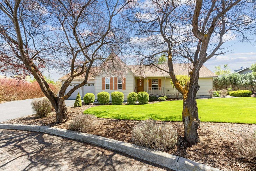 As you approach this well-kept home, you can't help but notice its charming exterior. The 1/2 acre lot is beautifully landscaped with lush greenery providing a warm
welcome to all who approach. Upon entering, you are immediately struck by the spaciousness of the living area. The vaulted ceiling adds to the feeling of openness. The
living room flows seamlessly into the dining area, making it a perfect place to entertain guests or gather with family.The kitchen is well-appointed, w/plenty of counter
space & all appliances included. The primary bedroom has an attached sunroom or office that provides a private retreat for work or relaxation. The two additional
bedrooms are spacious and comfortable. Large, heated 2-car garage w/workshop is perfect for the handyman or anyone who enjoys working on projects. Covered RV+
boat storage, complete with power & water. As you step outside, you can't help but marvel at the stunning views of the fields and rimrock.