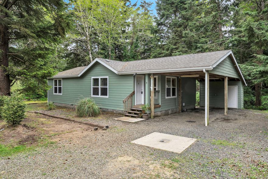 Nestled in a serene wooded setting on a spacious 0.51-acre lot, this charming home offers the perfect blend of privacy
and coastal living. The living/dining room features laminate flooring and open layout. The kitchen is well-sized and functional,
offering ample storage and plenty of counter space for all your cooking needs. A dedicated utility room is ready for washer and
dryer installation, adding to the home's convenience. Outside, you'll find a 1-car carport along with additional off-street parking,
perfect for accommodating guests, RVs, or recreational vehicles. A handy shed located next to the carport provides extra storage
for tools and outdoor gear. Situated just minutes from the beach, local dining, shopping, and the vibrant South Beach
community, this property is a hidden gem waiting for you to call it home.