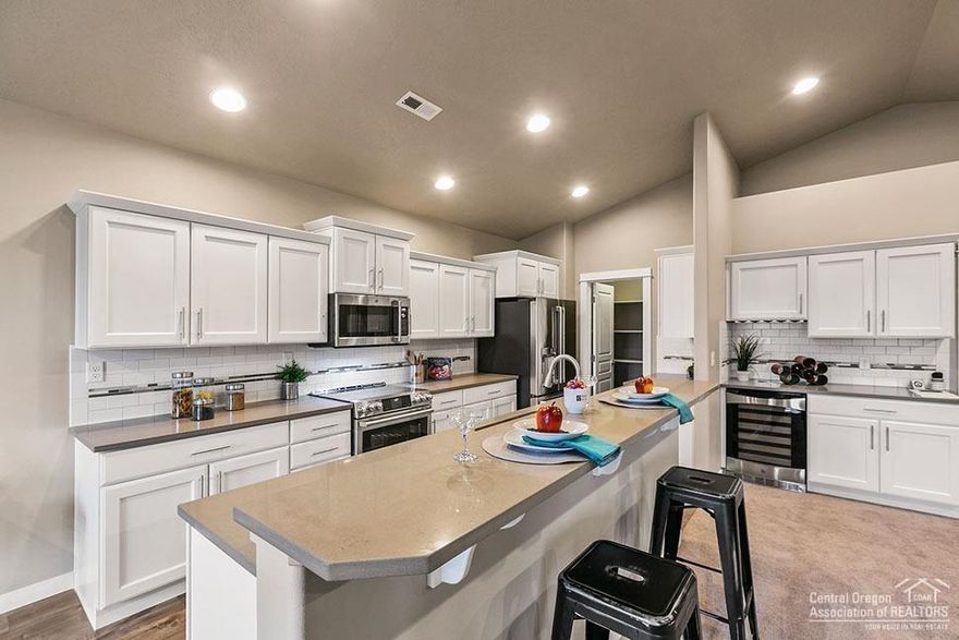 This 1800 Sq. Ft., single level Orchard plan is a home offering both space and comfort bordering the Deschutes National Forest. The open kitchen is a chef's dream, with counter space galore, plenty of cupboard storage, Costco sized pantry, and a breakfast bar. The expansive living room and adjoining dining area complete this eating and entertainment space. The large and private master suite boasts a dual vanity bathroom, separate shower and an enormous closet. Expected completion in December, photos are of a similar home.