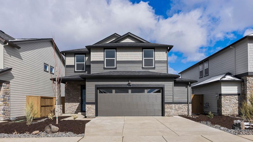 MOVE IN READY! SPECIAL RATE & closing cost incentive with use of builder's preferred lender!!  Must see corner lot home in Bend! Located near Reed Market Rd and Highway 20, where peaceful surroundings connect you to outdoor and city living. This magnificent Porter two-story floor plan has 5 beds, 3 baths, with a bed and bath on the main floor that is ideal for an at-home office or a guest bedroom. The great room has designer features with a fireplace and a floor-to-ceiling painted shiplap wall. The lavish kitchen has beautiful shaker cabinetry, quartz countertops with full tile backsplash, and stainless-steel appliances like a gas range with vent hood, built-in oven, and microwave. The primary bedroom is spacious, it has a walk-in closet, and an en suite bathroom with a double vanity. The hall bathroom adds extra comfort with a double vanity as well. Sales office hours are 10am - 5:30pm daily. Photos are representative of plan, features/specs may vary.