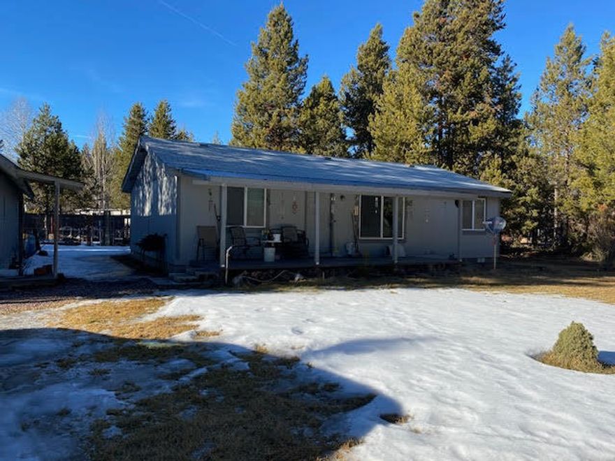 Cute little home located on a little over an acre.  Fenced on 3 sides with fence area in back that has raised garden beds, one full of strawberry bushes!!  Covered decks on both the front and back of the home.  Home needs a little paint but will be cleaned when seller moves out.   All Appliances stay.  40x24 shop with wood flooring , lots of shelves and attic area for more storage.  Attached storage port.  12x40 building built in 1959 was used as a cabin, has electric, plumbing and oil heater.  Oil tank sits outside of building.