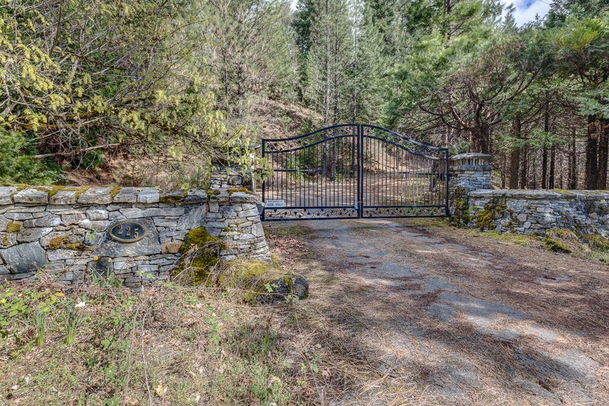 Terrific views of beautiful Lost Creek Lake. Lost Creek Lake is 3,430 acres, providing plenty of area for summertime watersports such as boating, skiing, wake boarding, tubing, and jet-skiing. The Lost Creek Lake is a popular year round spot for trout and small mouth bass fishing. Homesite is ready and previously had a custom 4569 sqft home on it. There is a large 1850 sqft garage that could be used to live in while you build your dream home. Also property has a pool, basketball court, pond and multiple fenced garden areas. This beautiful 32 plus acre property has a private paved drive & gated entry. The property is being sold as is and buyer is responsible for removal of debris. All information is deemed reliable but not verified; anyone considering purchasing this property should perform their own investigation into the uses and condition of the property.