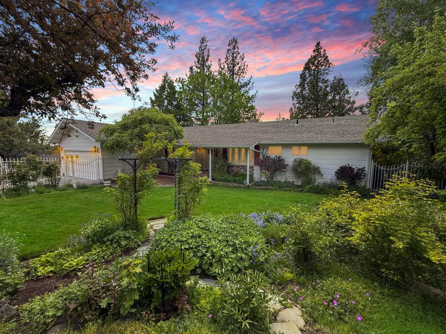 Stunning view home overlooking a forested back drop framed by snow-capped Mt Bachelor in an incredible location! Charming and spacious two level home located in an ideal West Hills location near Newport Market, Kanpai, and an easy bike ride or walk to other amenities as well as downtown. Lovingly owned and cared for by the same family for over 40 years, this home is surrounded by beautiful manicured grounds, rose gardens, and a ''river'' runs through it. Soak in beautiful views of Mt Bachelor and the Cascades from the entertainment size deck, and enjoy meals from the oversized kitchen. Spacious living room with vaulted ceilings and a mountain view is a great place to gather. Two spacious bedrooms plus den including a large primary bedroom and bathroom. Lower level features a game room w/built in bar, family room, two additional bedrooms, and lots of storage. Large 2-car garage & level driveway, great for all seasons. Blank canvas in an ideal location!