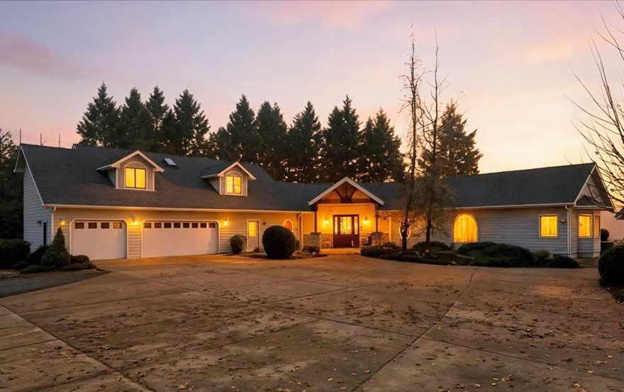 Discover this immaculate 1999 custom built, 3-bed, 3-bath home offering over 2,800 sq ft of updated, turnkey living.  Situated atop a private hill, the residence offers stunning panoramic views while maintaining complete privacy.  Main level features a gourmet kitchen with custom cabinetry & a built-in wine bar, all flowing into a spacious living area with grand vaulted ceilings. Main-floor primary suite includes a sitting area, patio access to enjoy the views, & a large ensuite with soaking tub & walk-in closet. Two guest bedrooms with dormer windows share a bathroom on the second level, offering a private space for visitors.  Massive 3-car garage, an RV barn, a 20 x32 garage for a boat or ATVs, & a shed, it's ready for a variety of uses. Recent upgrades, including a new roof, ensure this property is move-in ready.  As a bonus, this property includes $1815/month cell tower lease income. Towers on the perimeter of the property, hidden from view of the residence.