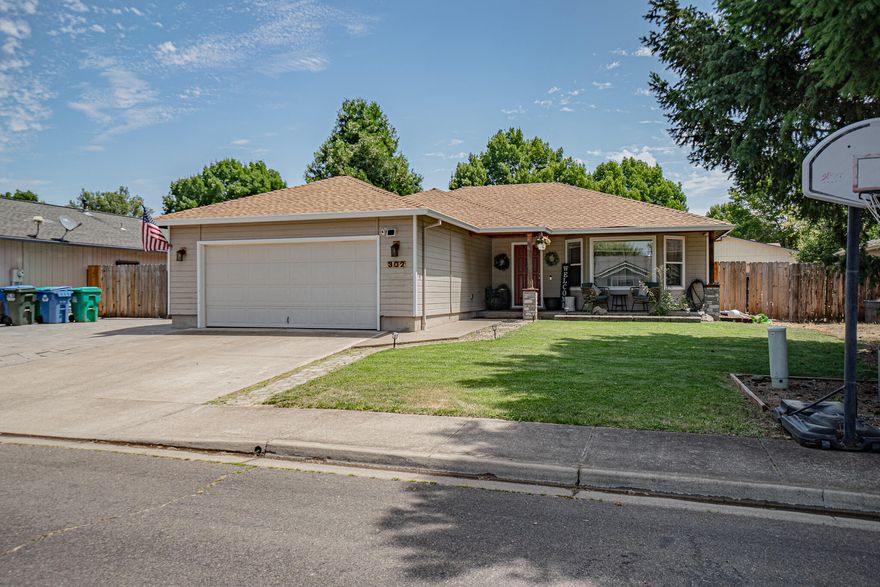 Discover the charm of 302 Candis Drive, nestled in the heart of Eagle Point's desirable 97524 zip code! Built in 1998, this one-story, 3-bedroom, 2-bath home offers approx. 1,200 sq ft of thoughtfully designed living space, with a functional floor plan that's perfect for cozy evenings or relaxed gatherings. Highlights include a bright, open-concept kitchen and living area, attached 2-car garage, and a private, fenced backyard ideal for outdoor entertaining or quiet mornings enjoying Oregon's natural beauty. Enjoy quick commutes to nearby Medford and the scenic Rogue River corridor. With its mix of modern comfort and timeless appeal, this gem presents a rare opportunity in today's market. Don't miss your chance. This well-maintained home is ready to welcome its next chapter! (Sellers are related to listing agent.)