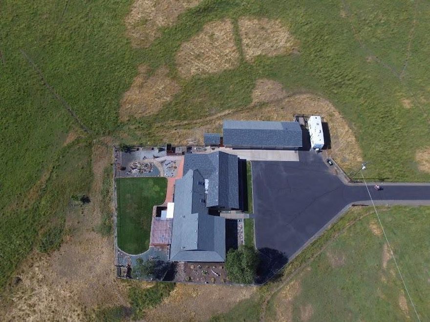 This beautiful ranch home facing east sits on almost 22 acres. The gorgeous home boasts 2152 sq. ft and has a three car detached garage. As you enter this ranch you will follow the paved driveway and notice the green pasture on both sides fed by the Eagle Point Irrigation district. Huge standard barn to your left. Views surround and will distract you. As you enter the home notice the huge living/ family room with a stove in the corner for the perfect ambiance. The kitchen has plenty of counter space as well as cabinets and cupboards. Windows let the natural light flow throughout. The master bedroom is extra large with views looking at Mt. McLaughlin. The walk in closet is above average. Two other good size rooms make up this home. Outside you will notice a great deck and as you look west notice the year round pond and lush pasture land. As you leave this home you can't help but focus on Mt. McLaughlin in the east. This home is immaculate. This will go fast!