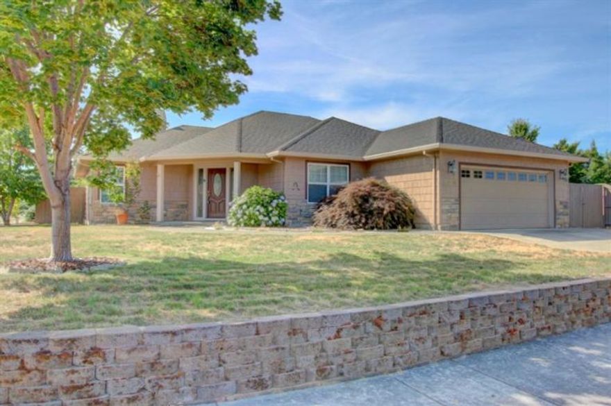 Lovely Home on Huge .20 Acre Corner Lot in The Fabulous Central Point East Subdivision! Double RV parking (one side paved) w/hook-ups. Grand entrance w/an abundance of gorgeous real oak hardwood floors. Lots of extras and upgrades here. Extremely well maintained 3 bedroom/2 bath home. Rock faade facing outside, high ceilings with lots of can lighting, living room with gas fireplace & mantle, tons of built-ins, lots of windows, solar tube and skylight inside and wired for sound with built-in speakers. Nice kitchen w/granite countertops, breakfast bar, custom raised-panel Oak cabinets & nice appliances. Huge dining area - great for entertaining! Built-in blinds in back door to back yard, inside laundry room w/sink. Large master suite with slider to the covered back patio, large walk-in closet, and master bath w/double sinks and walk-in shower. Nicely landscaped with timed in-ground sprinklers & finished 2-car garage. This one shows beautifully!